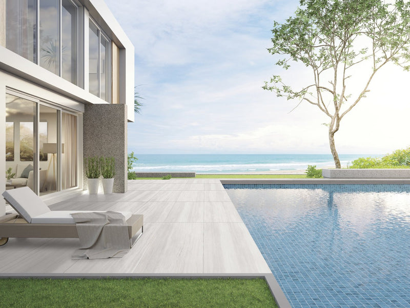 Zenit White Polished Travertine Look Porcelain Tiles 24x48 installed in an outdoor space